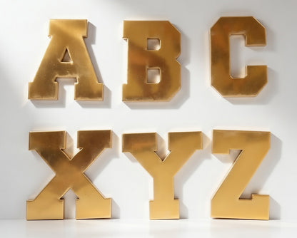 Gold letters A to Z on a white background