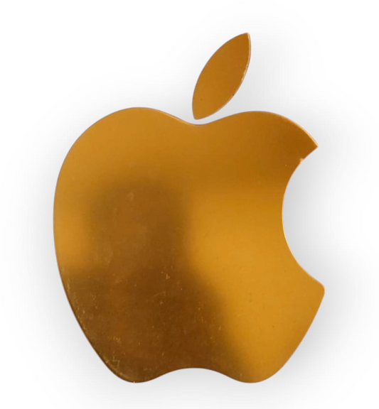 A gold-colored, apple-shaped acrylic cutout.