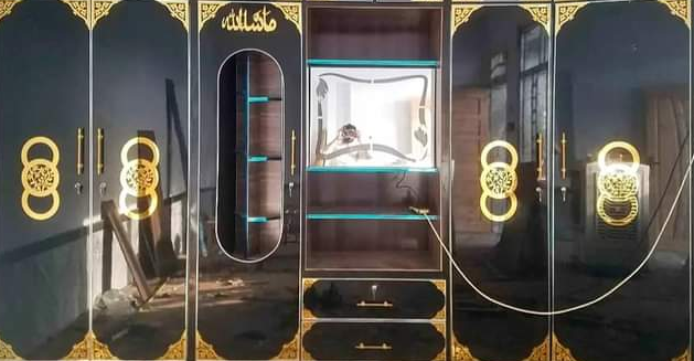 Large black wardrobe with gold circular shape acrylic C-1 design accents and mirrors inside