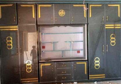 Black and gold wardrobe with simple patti shape design 