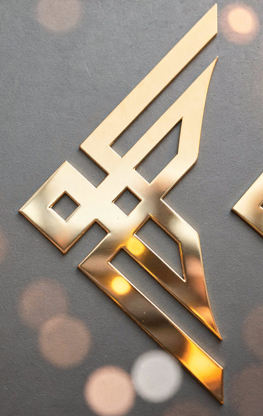 Gold logo on a dark background