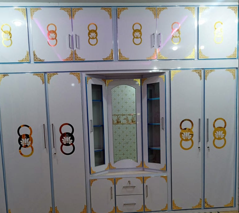 Large wardrobe with Triangle Shape acrylic T-2 design with other decorative items .